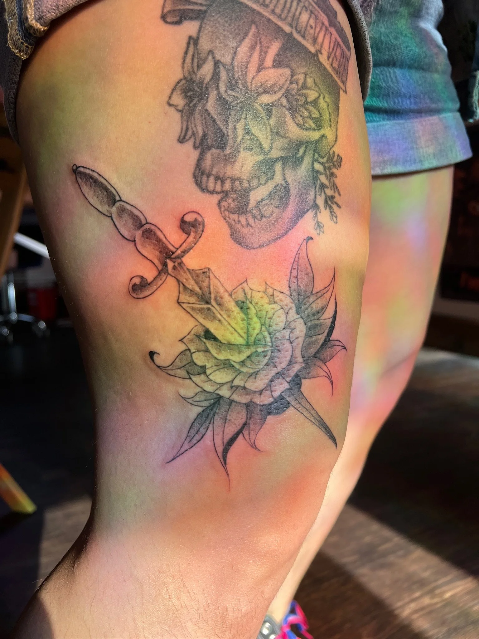 Sword and flowers tattoo by Al